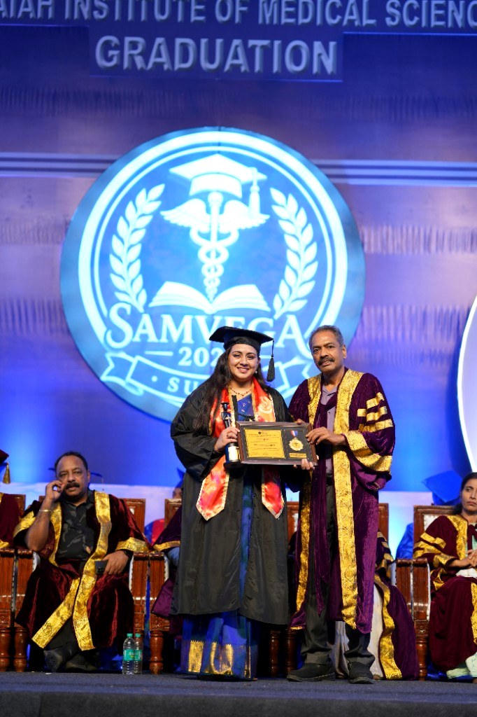 Receiving recognition at medical college graduation